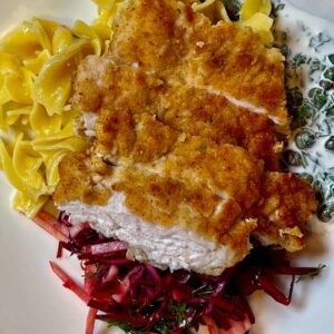 crispy turkey schnitzel with noodles and red cabbage salad