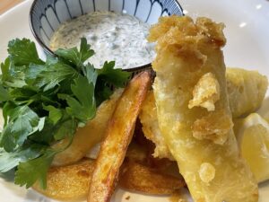 plate of fish & chips with tartar dipping sauce
