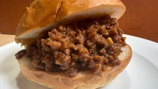 plate with a sloppy joes sandwiches