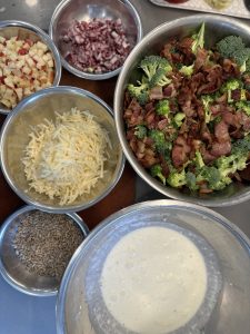 broccoli salad, ingredients in separate bowls
