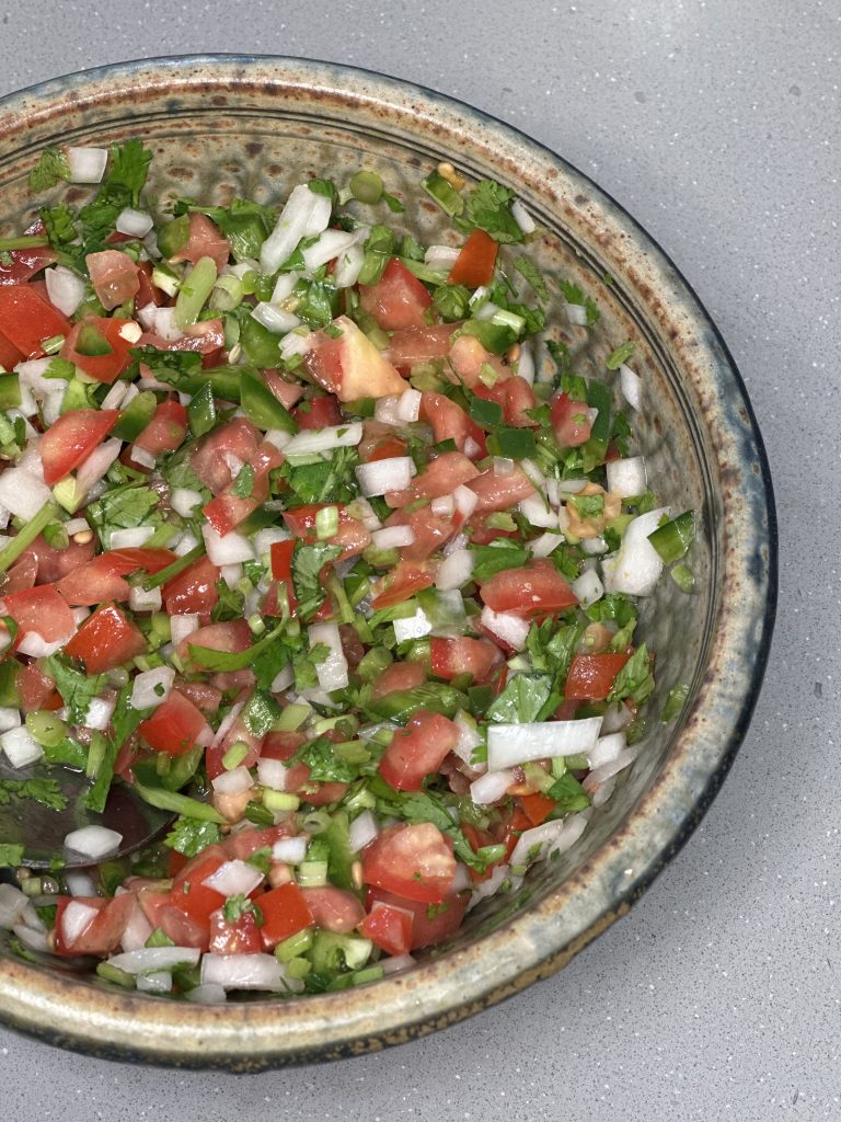 pico de gallo in a rustic bowl