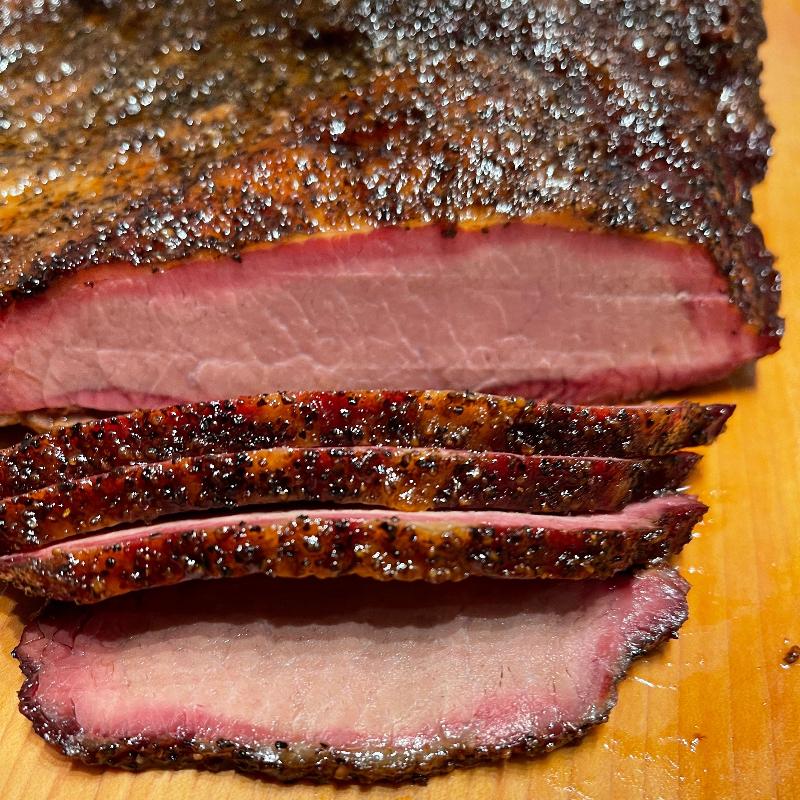 Brisket; sliced on a cutting board