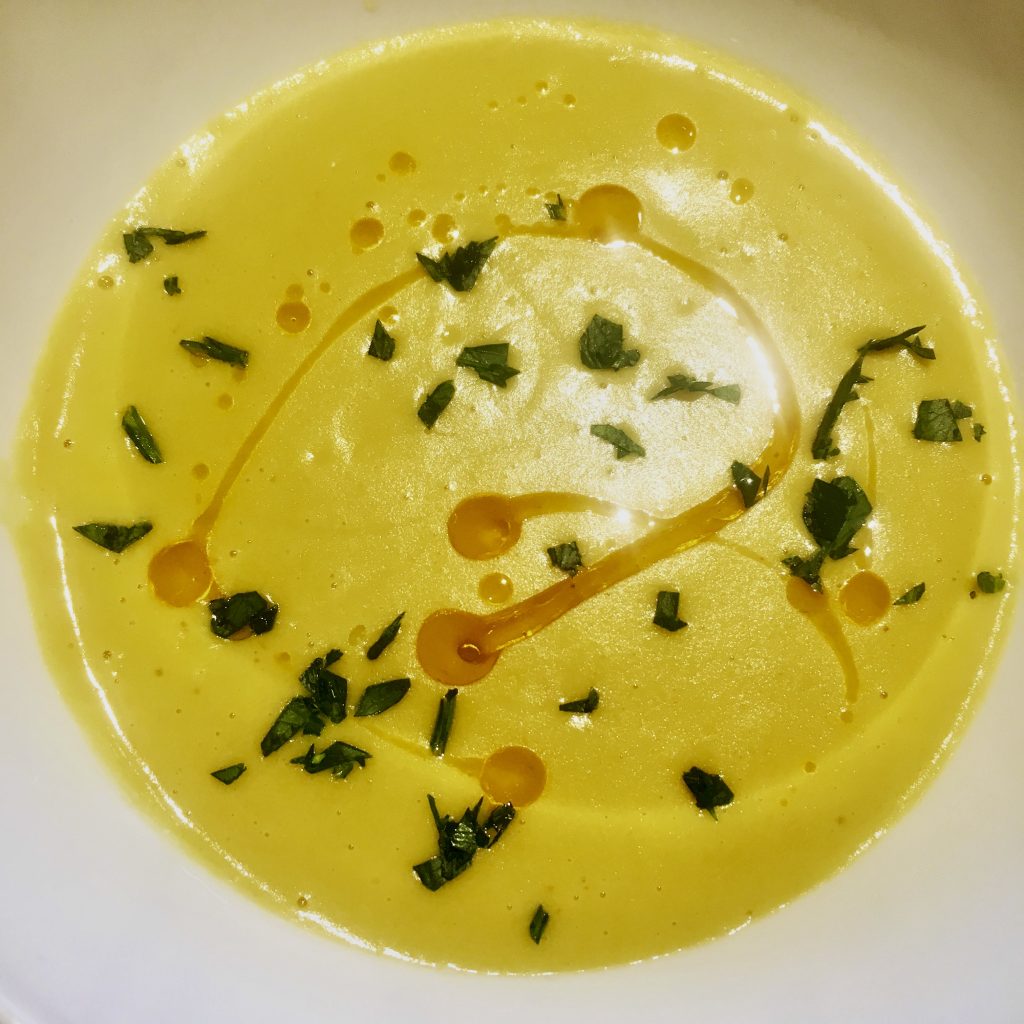 Squash soup garnished with parsley