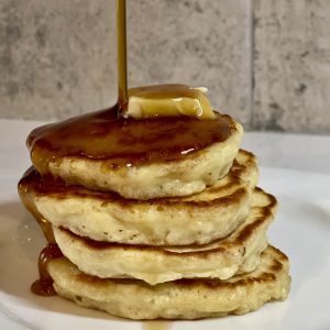a stack of pancakes with maple syrup