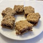 Date squares on a white plate