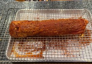 Spice rubbed pork tenderloin on a rack