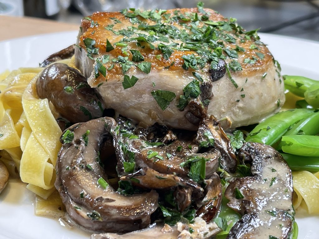 Pork Chops with creamy mushroom sauce and buttered noodles