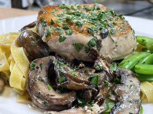 Pork Chops with creamy mushroom sauce and buttered noodles